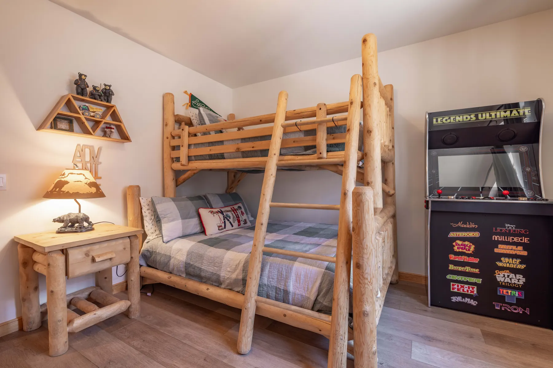 Bedroom Three at Pine Grove Cabin with the Legends Ultimate arcade cabinet loaded with classic games next to the log bunk bed