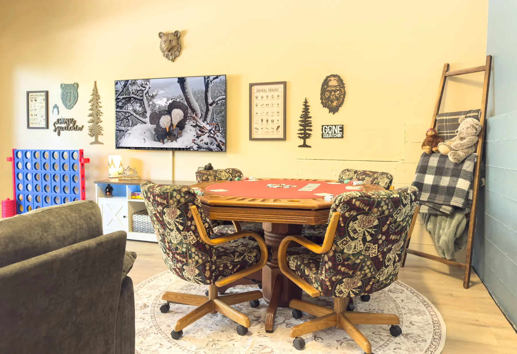Poker table set up with cards and chips in the Sasquatch Den at Pine Grove Cabin